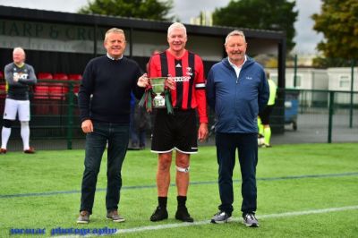 Colin Young receiving the 2025 Paul Gray Memorial Cup from Colin & Alastair Gray